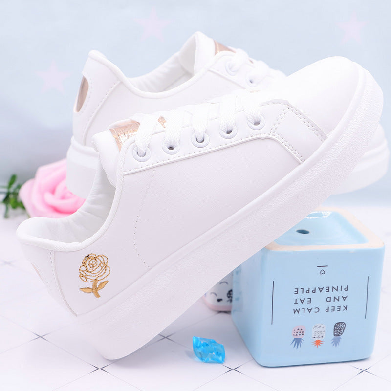 Baskets blanches roses