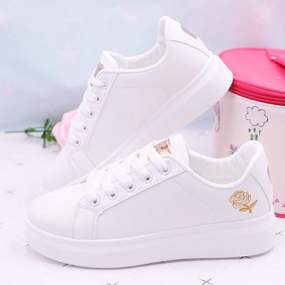Baskets blanches roses